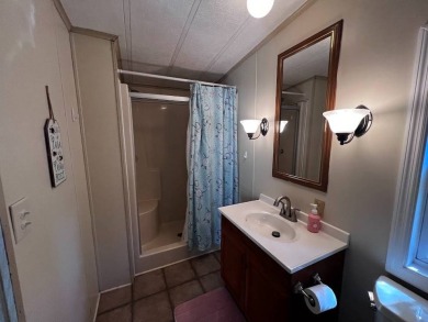 Discover easy Florida living in this 2-bedroom, 2-bath home on Lake Henry Golf Club in Florida - for sale on GolfHomes.com, golf home, golf lot