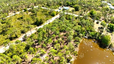 Spacious lakefront lot in Tropical Gulf Acres, offering a serene on Seminole Lakes Country Club in Florida - for sale on GolfHomes.com, golf home, golf lot