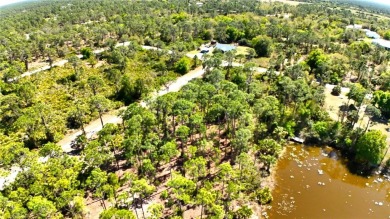 Spacious lakefront lot in Tropical Gulf Acres, offering a serene on Seminole Lakes Country Club in Florida - for sale on GolfHomes.com, golf home, golf lot