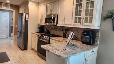 Turnkey, updated, maintained with an open checkbook, and on a on Summerglen Country Club in Florida - for sale on GolfHomes.com, golf home, golf lot