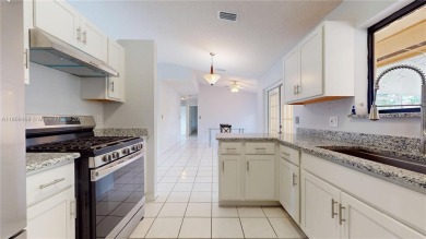 Discover your dream home in this beautifully designed residence on Palmetto Golf Course in Florida - for sale on GolfHomes.com, golf home, golf lot