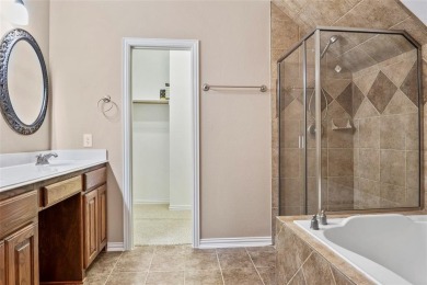 Welcome to this elegant stone-and-brick David Weekly home in the on Lantana Golf Club in Texas - for sale on GolfHomes.com, golf home, golf lot