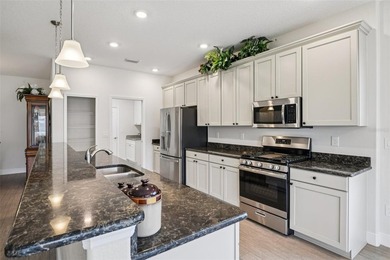 This Beautiful LIGHT AND BRIGHT *Calla II Model* Home is located on Arlington Ridge Golf Club in Florida - for sale on GolfHomes.com, golf home, golf lot