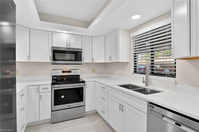 This beautifully renovated first-floor residence offers 2 on Royal Palm Golf Club in Florida - for sale on GolfHomes.com, golf home, golf lot