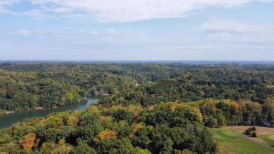 Double lot wooded property in Hocking Hills near the entrance in on Hide-A-Way Hills Golf Club in Ohio - for sale on GolfHomes.com, golf home, golf lot