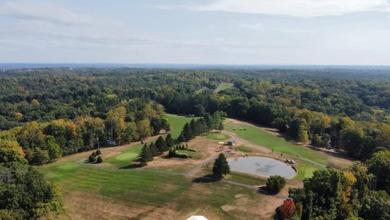 Double lot wooded property in Hocking Hills near the entrance in on Hide-A-Way Hills Golf Club in Ohio - for sale on GolfHomes.com, golf home, golf lot