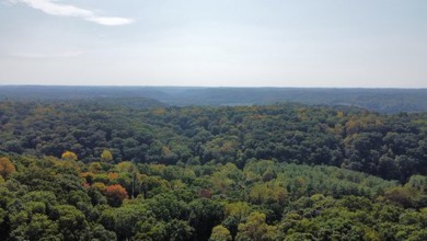 Double lot wooded property in Hocking Hills near the entrance in on Hide-A-Way Hills Golf Club in Ohio - for sale on GolfHomes.com, golf home, golf lot