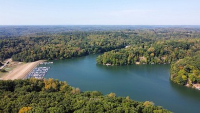 Double lot wooded property in Hocking Hills near the entrance in on Hide-A-Way Hills Golf Club in Ohio - for sale on GolfHomes.com, golf home, golf lot