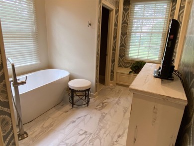 This stunning custom-built 4-bedroom home is perfectly situated on Helena Country Club in Arkansas - for sale on GolfHomes.com, golf home, golf lot