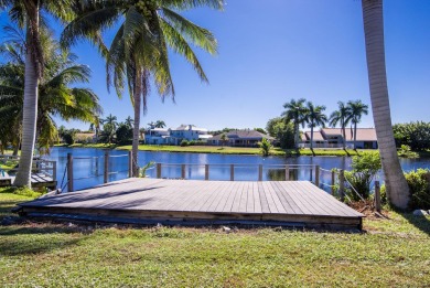 This extremely bright and expansive lakefront home in Greenview on Greenview Cove Golf Club in Florida - for sale on GolfHomes.com, golf home, golf lot