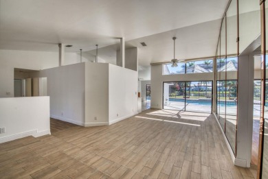 This extremely bright and expansive lakefront home in Greenview on Greenview Cove Golf Club in Florida - for sale on GolfHomes.com, golf home, golf lot