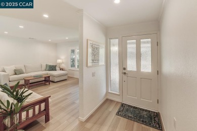 Step into this sophisticated level-in, single row and end unit on Rossmoor Golf Course in California - for sale on GolfHomes.com, golf home, golf lot