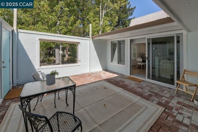 Step into this sophisticated level-in, single row and end unit on Rossmoor Golf Course in California - for sale on GolfHomes.com, golf home, golf lot