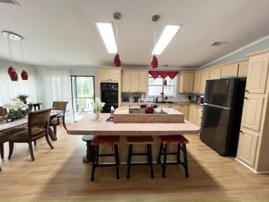 This Casa Grande model home has a view of the golf course from on Del Tura Golf and Country Club in Florida - for sale on GolfHomes.com, golf home, golf lot