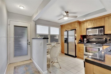 Welcome home to this desirable ground floor condo in one of the on Wynmoor Golf Course in Florida - for sale on GolfHomes.com, golf home, golf lot