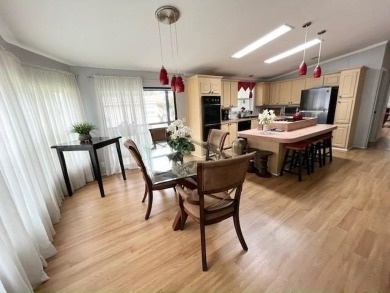 This Casa Grande model home has a view of the golf course from on Del Tura Golf and Country Club in Florida - for sale on GolfHomes.com, golf home, golf lot