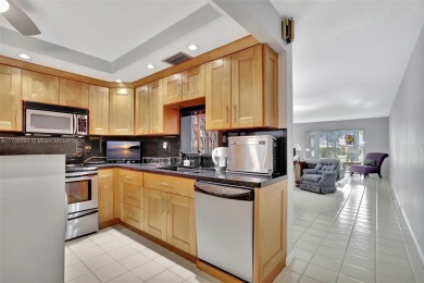 Welcome home to this desirable ground floor condo in one of the on Wynmoor Golf Course in Florida - for sale on GolfHomes.com, golf home, golf lot