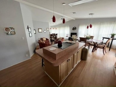This Casa Grande model home has a view of the golf course from on Del Tura Golf and Country Club in Florida - for sale on GolfHomes.com, golf home, golf lot
