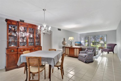 Welcome home to this desirable ground floor condo in one of the on Wynmoor Golf Course in Florida - for sale on GolfHomes.com, golf home, golf lot