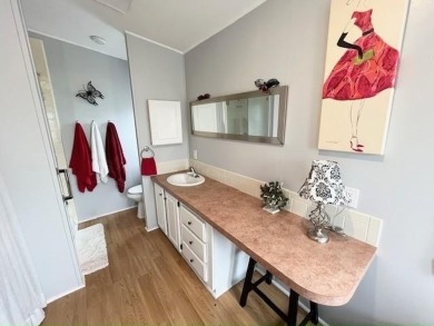 This Casa Grande model home has a view of the golf course from on Del Tura Golf and Country Club in Florida - for sale on GolfHomes.com, golf home, golf lot