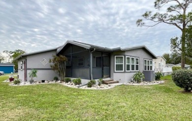 This Casa Grande model home has a view of the golf course from on Del Tura Golf and Country Club in Florida - for sale on GolfHomes.com, golf home, golf lot