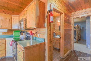 This 3,201 square foot cabin is conveniently located at the IP on Island Park Village Resort Golf Course in Idaho - for sale on GolfHomes.com, golf home, golf lot