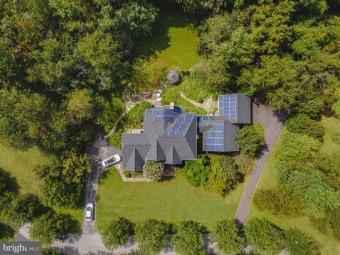 This exquisite custom-built home is situated on  a beautiful 1.2 on Cattail Creek Country Club in Maryland - for sale on GolfHomes.com, golf home, golf lot