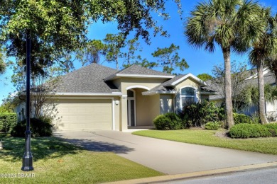 Welcome to your next haven with a scenic backyard view of the on Plantation Bay Golf and Country Club in Florida - for sale on GolfHomes.com, golf home, golf lot