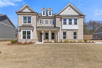 Nestled in the sought-after Traditions of Braselton community on Traditions of Braselton Golf Club in Georgia - for sale on GolfHomes.com, golf home, golf lot