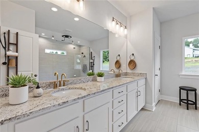 Nestled in the sought-after Traditions of Braselton community on Traditions of Braselton Golf Club in Georgia - for sale on GolfHomes.com, golf home, golf lot