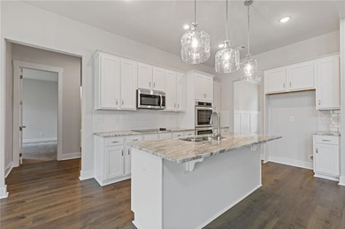 Nestled in the sought-after Traditions of Braselton community on Traditions of Braselton Golf Club in Georgia - for sale on GolfHomes.com, golf home, golf lot