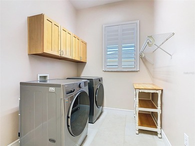 Immaculate & Well Maintained RHAPSODY model on a serene on Poinciana Golf Club in Florida - for sale on GolfHomes.com, golf home, golf lot