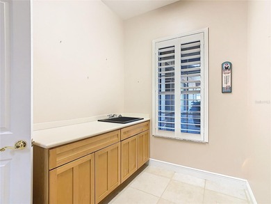 Immaculate & Well Maintained RHAPSODY model on a serene on Poinciana Golf Club in Florida - for sale on GolfHomes.com, golf home, golf lot