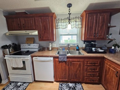 This home is on leased land, buyers do not own the land. This on Big Cypress Golf and Country Club in Florida - for sale on GolfHomes.com, golf home, golf lot