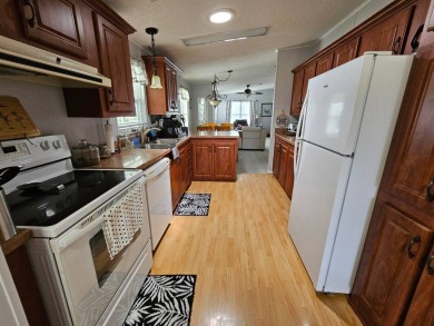 This home is on leased land, buyers do not own the land. This on Big Cypress Golf and Country Club in Florida - for sale on GolfHomes.com, golf home, golf lot