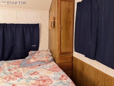 So much here for a great price! A living room and a bedroom are on River Ridge Golf Club in Virginia - for sale on GolfHomes.com, golf home, golf lot