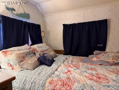 So much here for a great price! A living room and a bedroom are on River Ridge Golf Club in Virginia - for sale on GolfHomes.com, golf home, golf lot