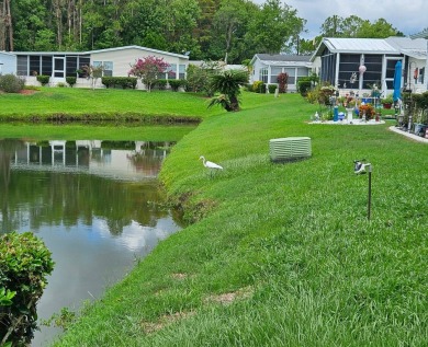 This home is on leased land, buyers do not own the land. This on Big Cypress Golf and Country Club in Florida - for sale on GolfHomes.com, golf home, golf lot