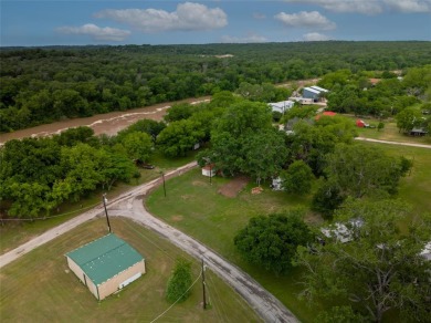 Situated near the beautiful Brazos River in Horseshoe Bend on Horseshoe Bend Country Club in Texas - for sale on GolfHomes.com, golf home, golf lot