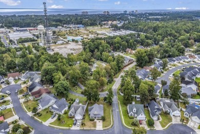 Located just a stone's throw from the beach, this charming home on Tupelo Bay Golf Complex  in South Carolina - for sale on GolfHomes.com, golf home, golf lot