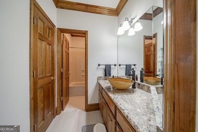 Tucked within the sought-after Estates section of Horseshoe Bend on Horseshoe Bend Country Club in Georgia - for sale on GolfHomes.com, golf home, golf lot