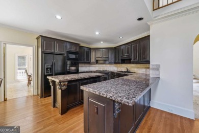 Experience three fully finished levels of exceptional living on The Golf Club of Georgia in Georgia - for sale on GolfHomes.com, golf home, golf lot