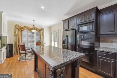 Experience three fully finished levels of exceptional living on The Golf Club of Georgia in Georgia - for sale on GolfHomes.com, golf home, golf lot