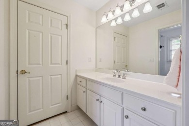 Experience three fully finished levels of exceptional living on The Golf Club of Georgia in Georgia - for sale on GolfHomes.com, golf home, golf lot