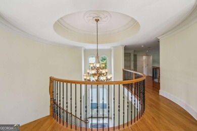 Experience three fully finished levels of exceptional living on The Golf Club of Georgia in Georgia - for sale on GolfHomes.com, golf home, golf lot