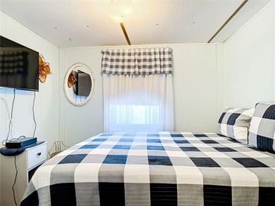 CHARMING, UNIQUE, MOBILE HOME IN FABULOUS HOLIDAY PARK, A on Sabal Trace Golf and Country Club in Florida - for sale on GolfHomes.com, golf home, golf lot