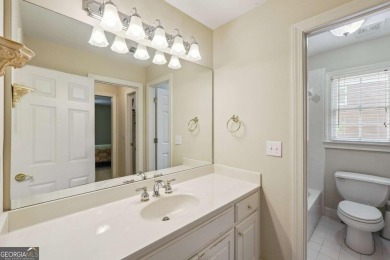 Experience three fully finished levels of exceptional living on The Golf Club of Georgia in Georgia - for sale on GolfHomes.com, golf home, golf lot