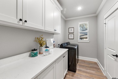 This inviting home welcomes you the moment you step through the on Hide-A-Way Lake Golf Course in Texas - for sale on GolfHomes.com, golf home, golf lot