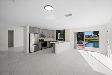 Beautifully updated pool home located on a golf course, offering on Rotonda Golf and Country Club The Hills Course in Florida - for sale on GolfHomes.com, golf home, golf lot