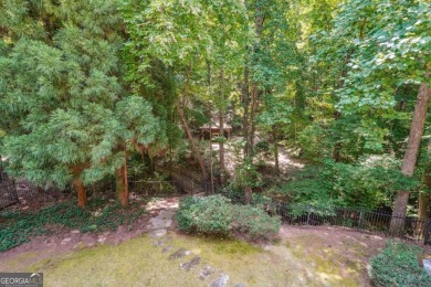 Experience three fully finished levels of exceptional living on The Golf Club of Georgia in Georgia - for sale on GolfHomes.com, golf home, golf lot